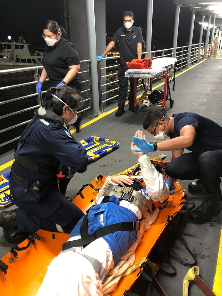 Fallen man lying on stretcher on offshore vessel
