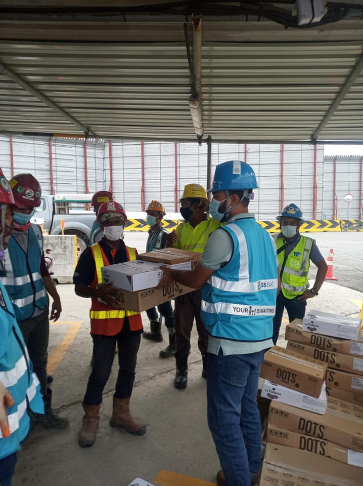 volunteers donuts migrant workers