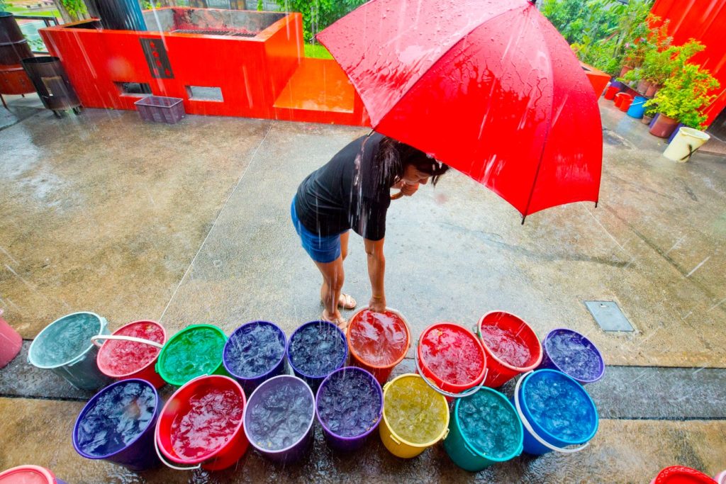 HDB Resident Shows Ingenious Way Of Collecting Rainwater Using An Umbrella
