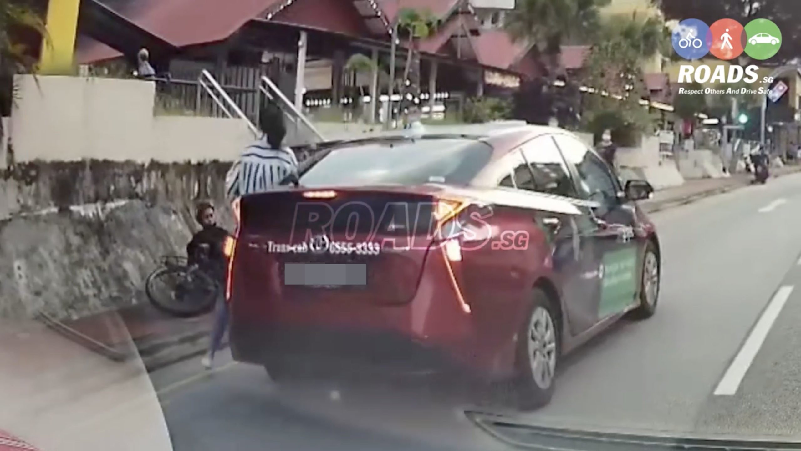 cyclist crashes taxi door