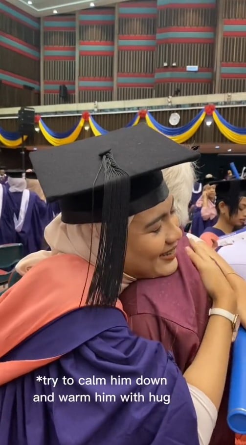 father tears daughter graduate