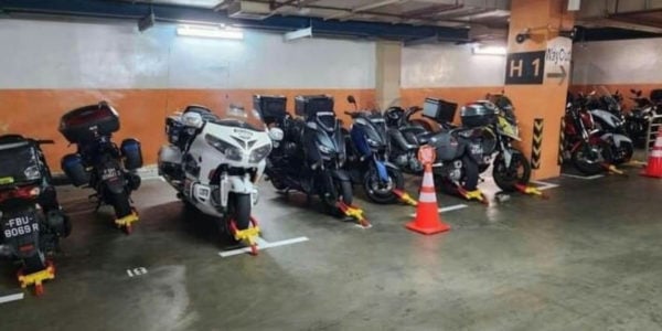 Row Of Motorcycles Get Wheel-Clamped In NUH Carpark For Occupying Lots Meant For Cars