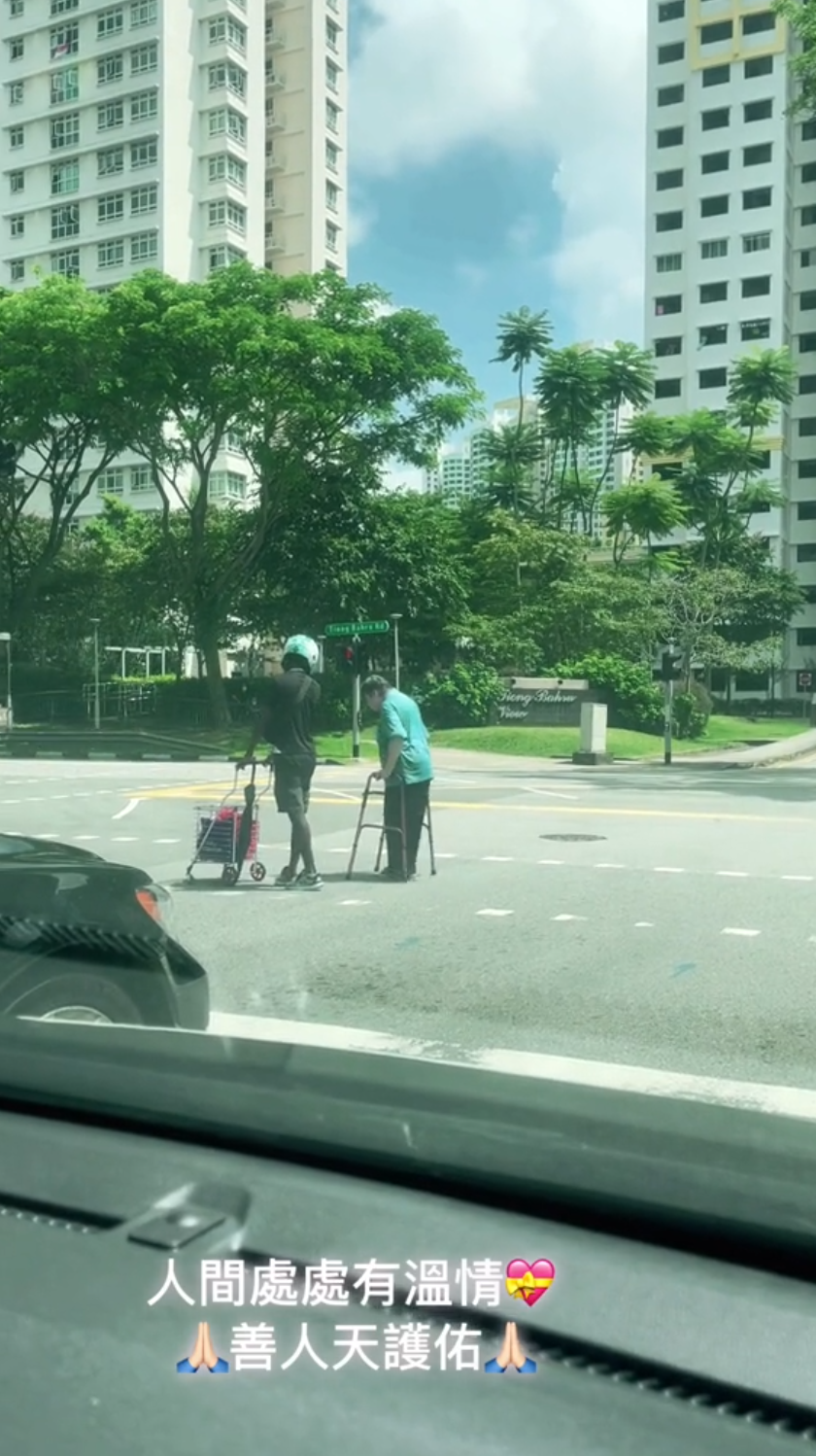 helps elderly cross roads