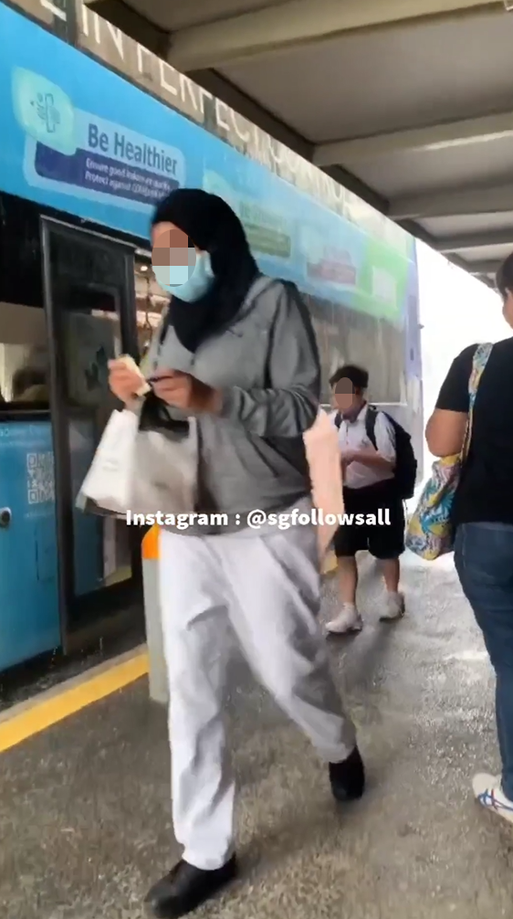 Schoolboy Shelters Alighting Bus Passengers With Umbrella In Punggol ...