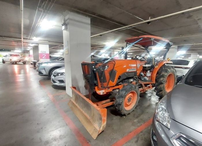 Man drives tractor mall