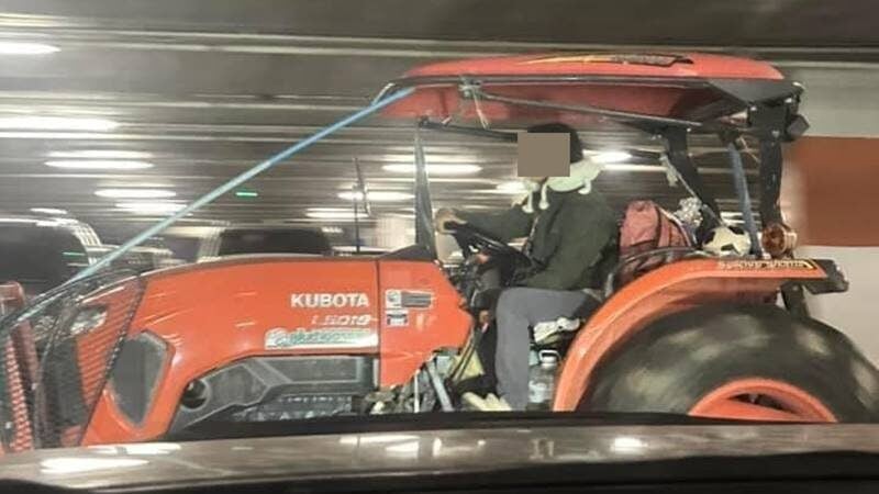 Man drives tractor mall