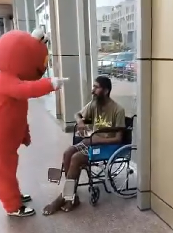 Elmo mascot assault 3
