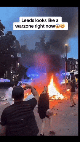 uk rioters bus fire