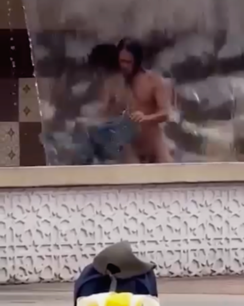man naked bathing in KL fountain