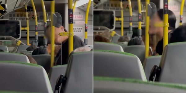 woman licking bus handrail