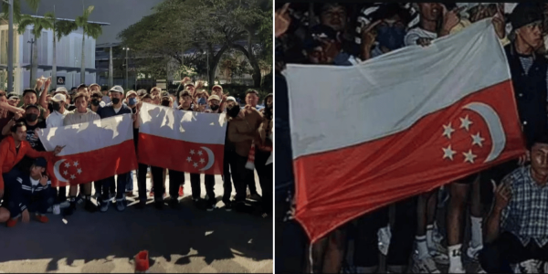 M’sian football fans pose with upside-down S’pore flag after ASEAN Championship elimination