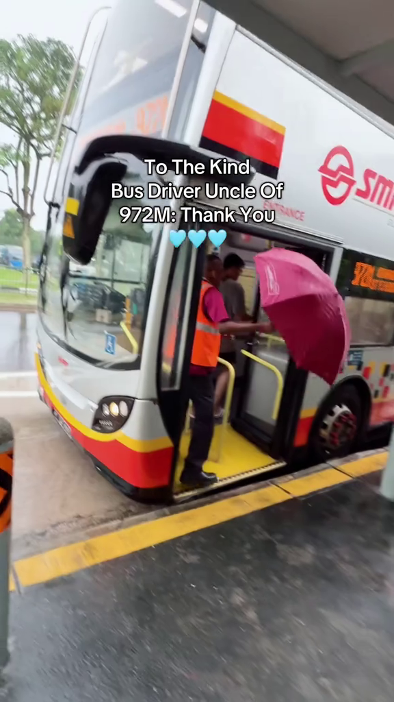 bus driver umbrella rain smrt