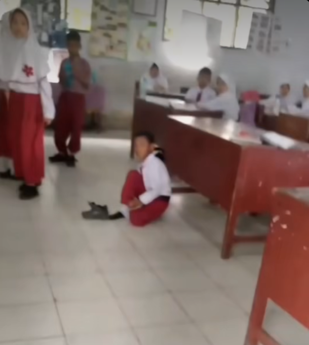 student sit floor