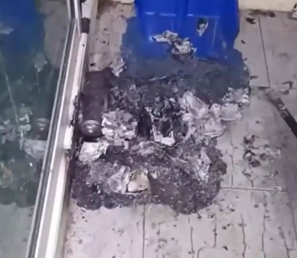 man balcony extinguish fire