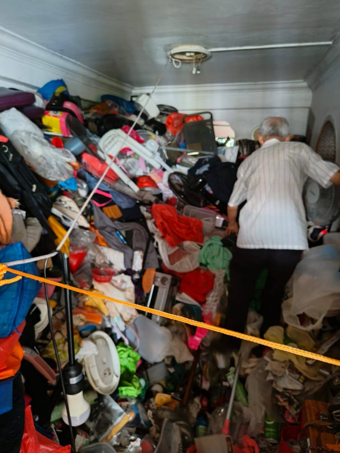 Elderly hoarder lives alone in heavily cluttered Bedok Reservoir flat ...