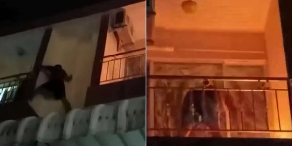 man balcony extinguish fire