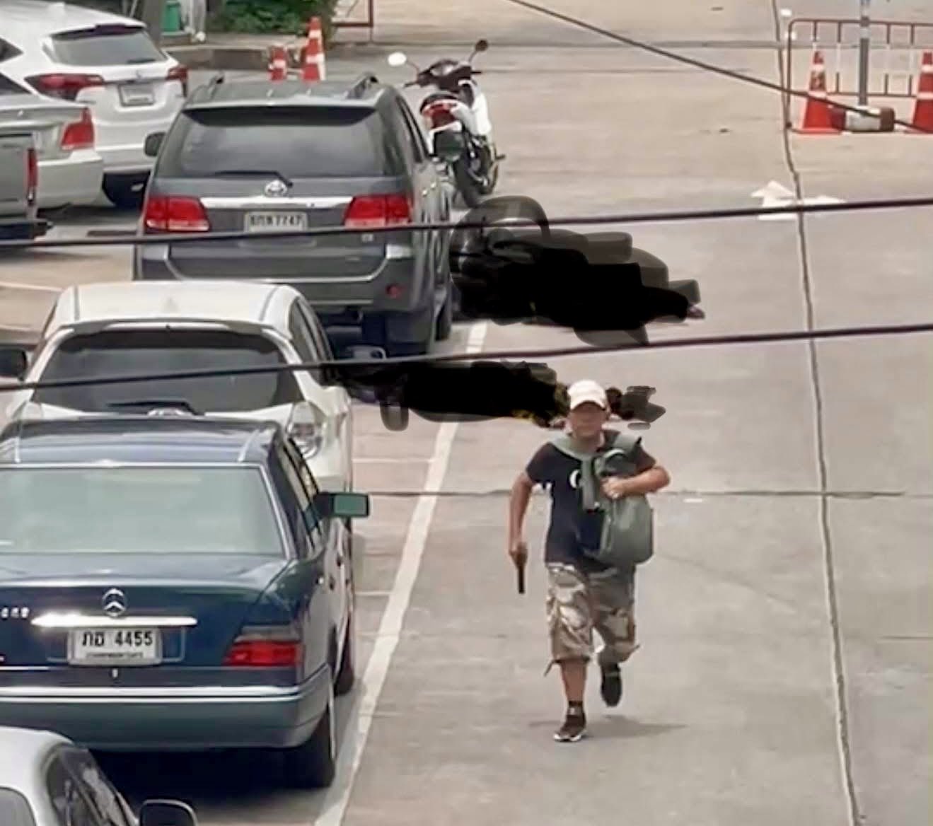 gunman bangkok market