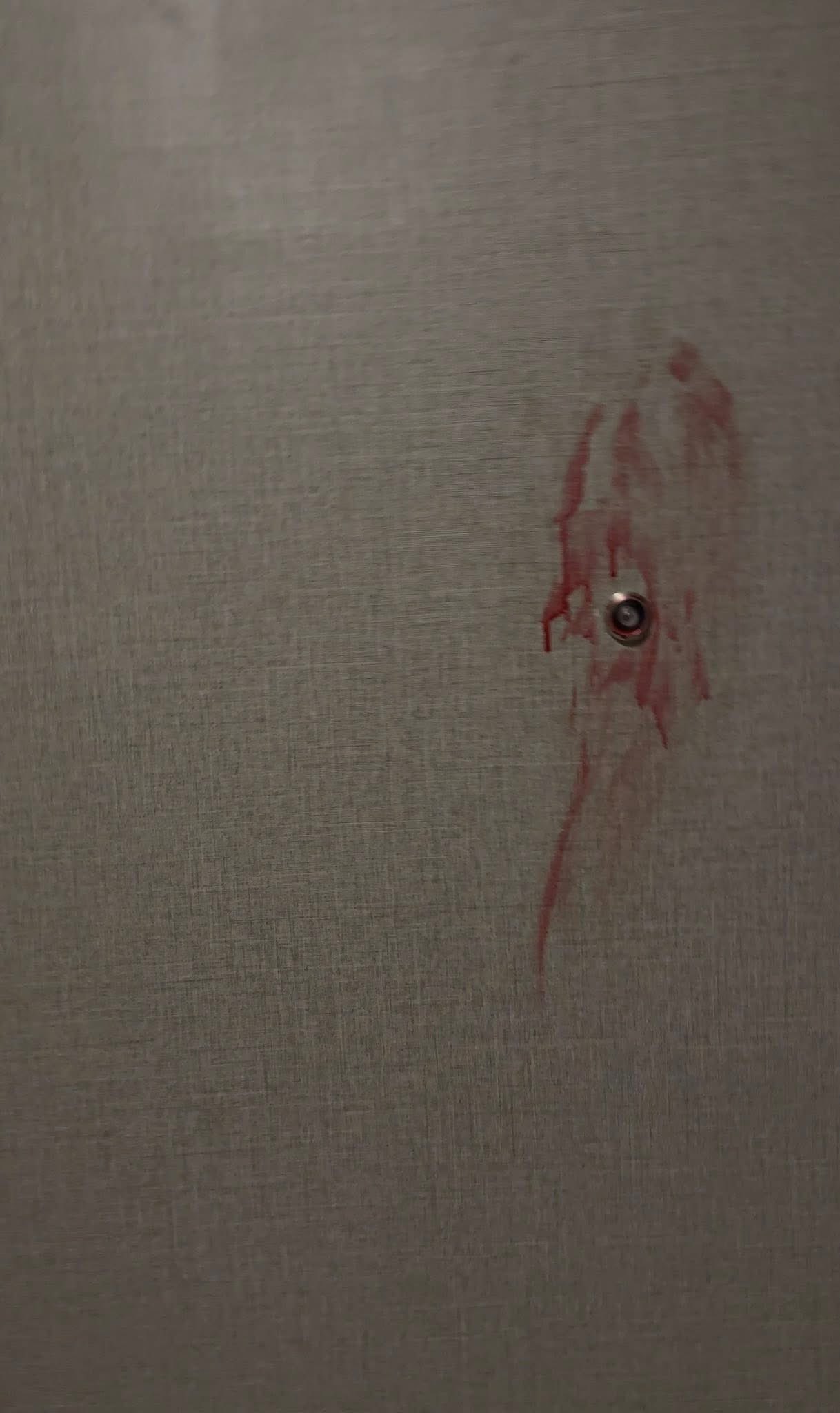 man bangs door knife photo