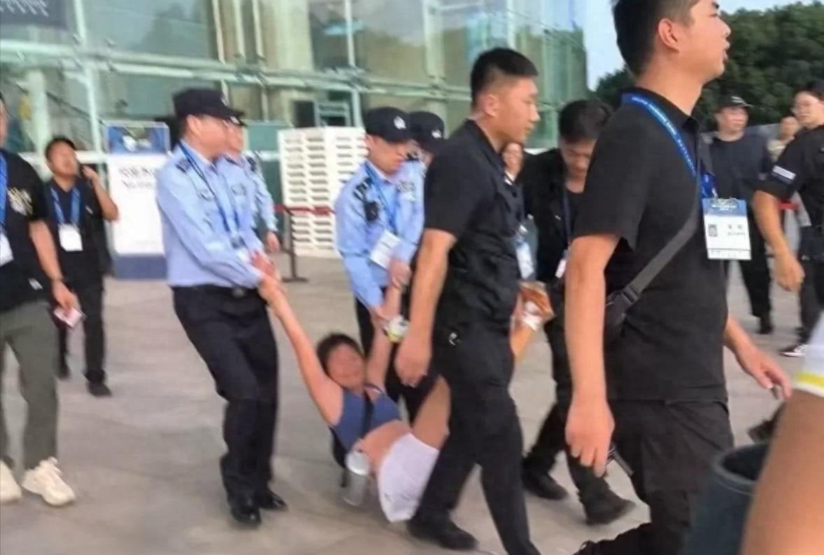 drunk woman tennis tournament escorted