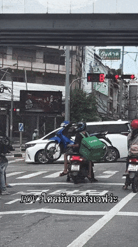 men carrying motorcycle