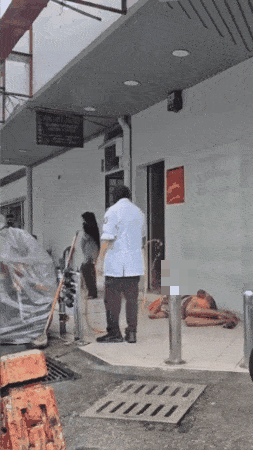 homeless man kicked water