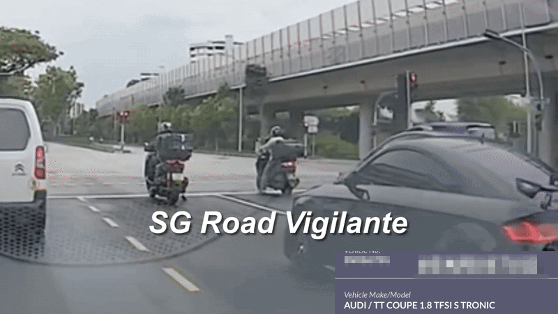 motorcyclist car red light