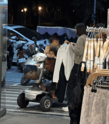 staff helps elderly woman PMA