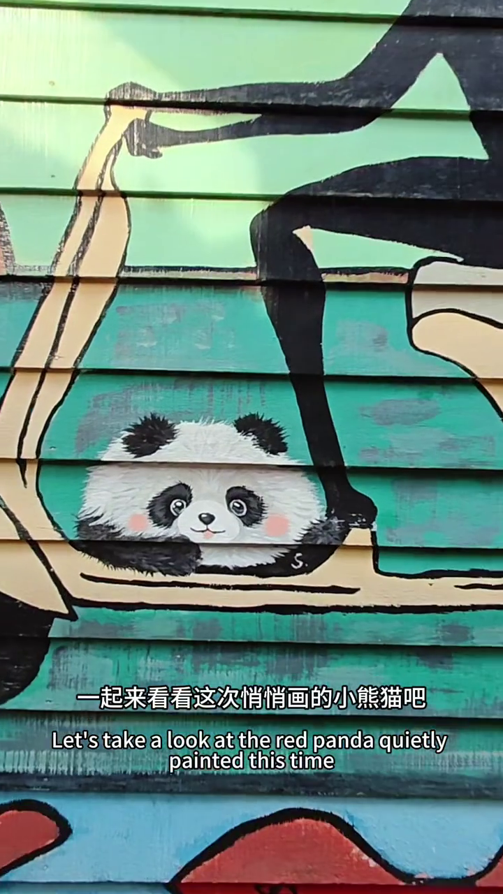 tourist painting panda mural completed