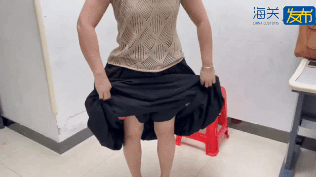 woman smuggle fish under skirt 2