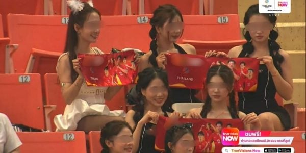 Live broadcast of 33rd SEA Games match shows women holding up scarves that promote gambling site