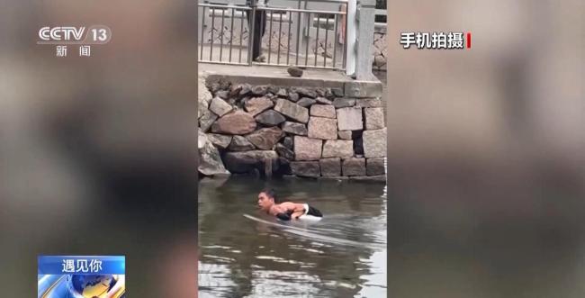 man rescue elderly river