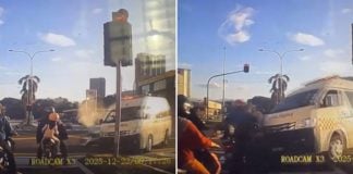 Ambulance crashes motorists red light