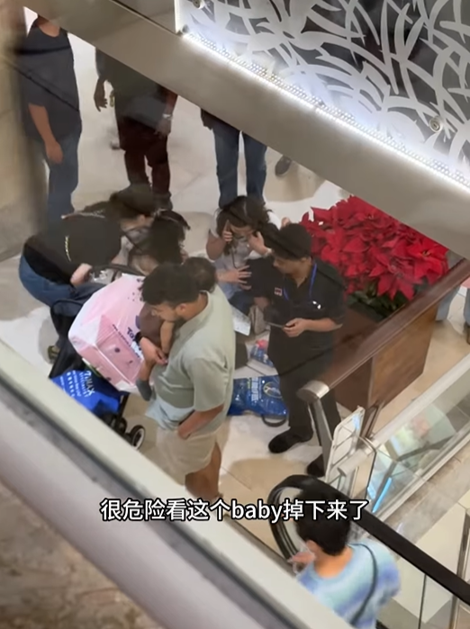 boy stroller falls escalator (2)