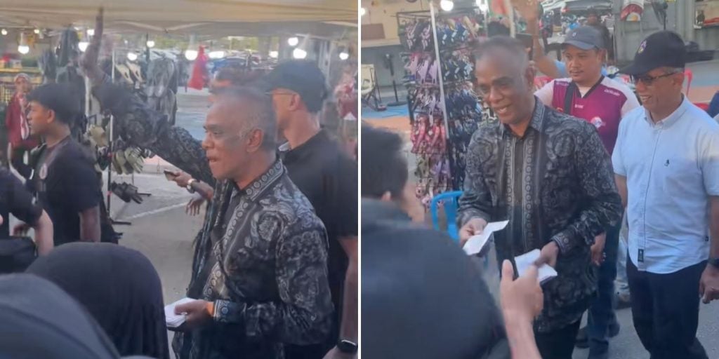 businessman gives away money beach