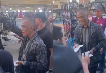 businessman gives away money beach