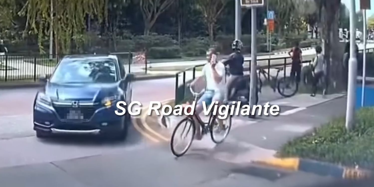 A cyclist talking on his mobile phone rode across a road in Canberra, only to be hit by a turning car and knocked down.