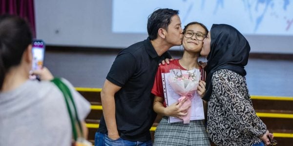 parents celebrate child