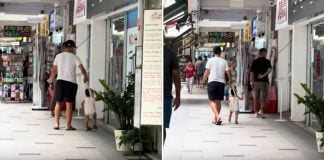 father and child in tote bag