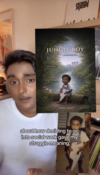 man showing book cover 