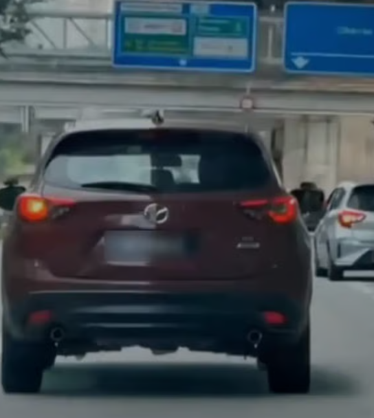 man pointing toy gun