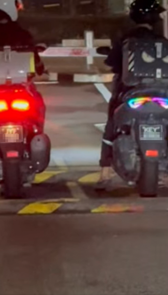 two bikers at gantry