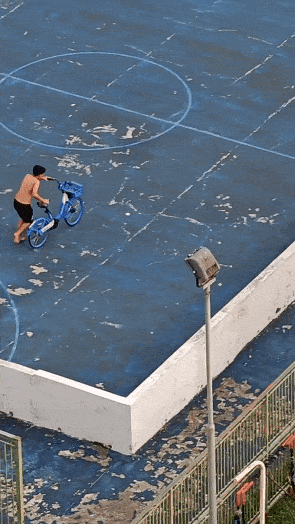 boy runs with bicycle 
