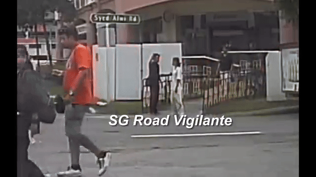 boy and girl gesture towards scene of accident