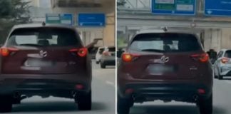 man pointing toy gun