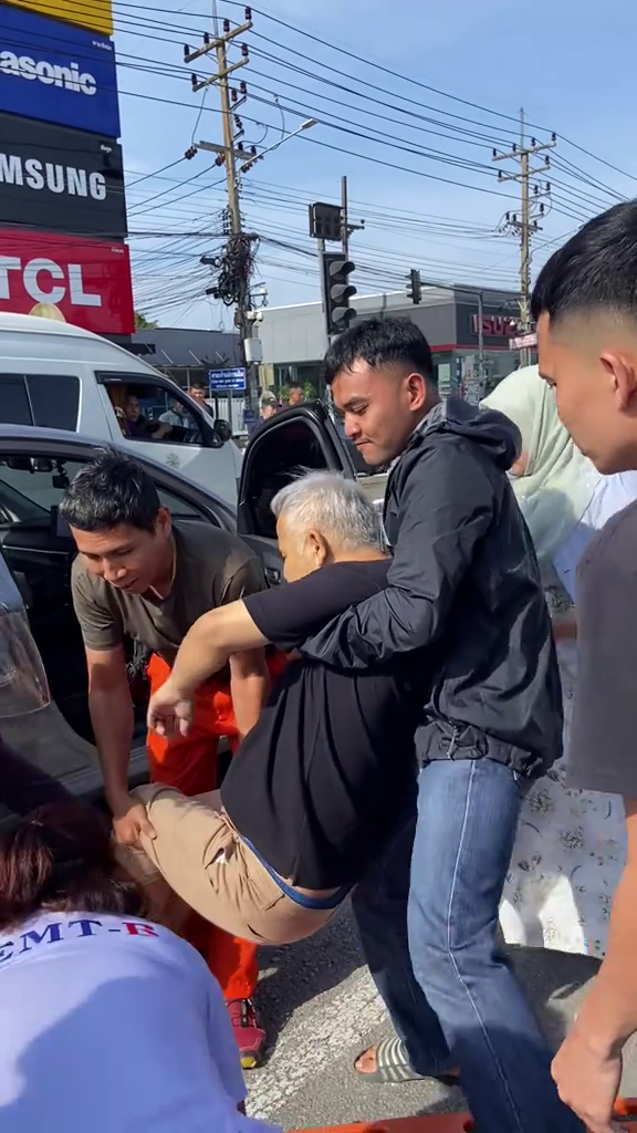 passersby break man car rescue