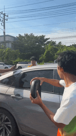 passersby break man car headrest