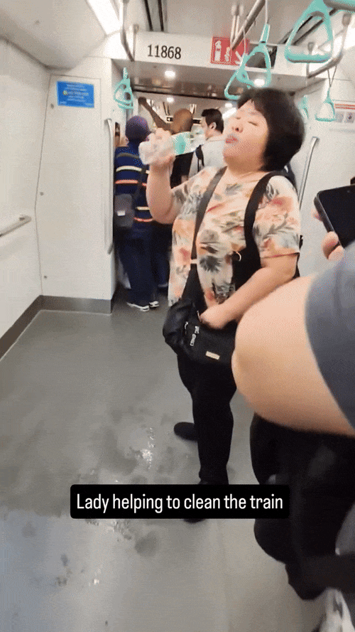 woman spitting water charged