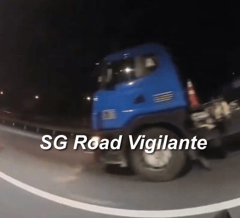 motorcyclist truck wheels aye