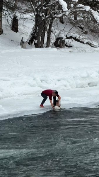 mother daughter freezing river
