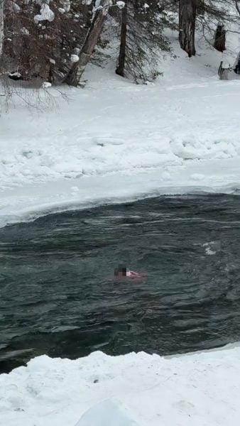 mother daughter freezing river
